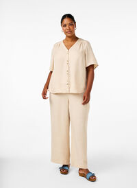 Loose trousers with elasticated waistband and pockets, Cement, Model