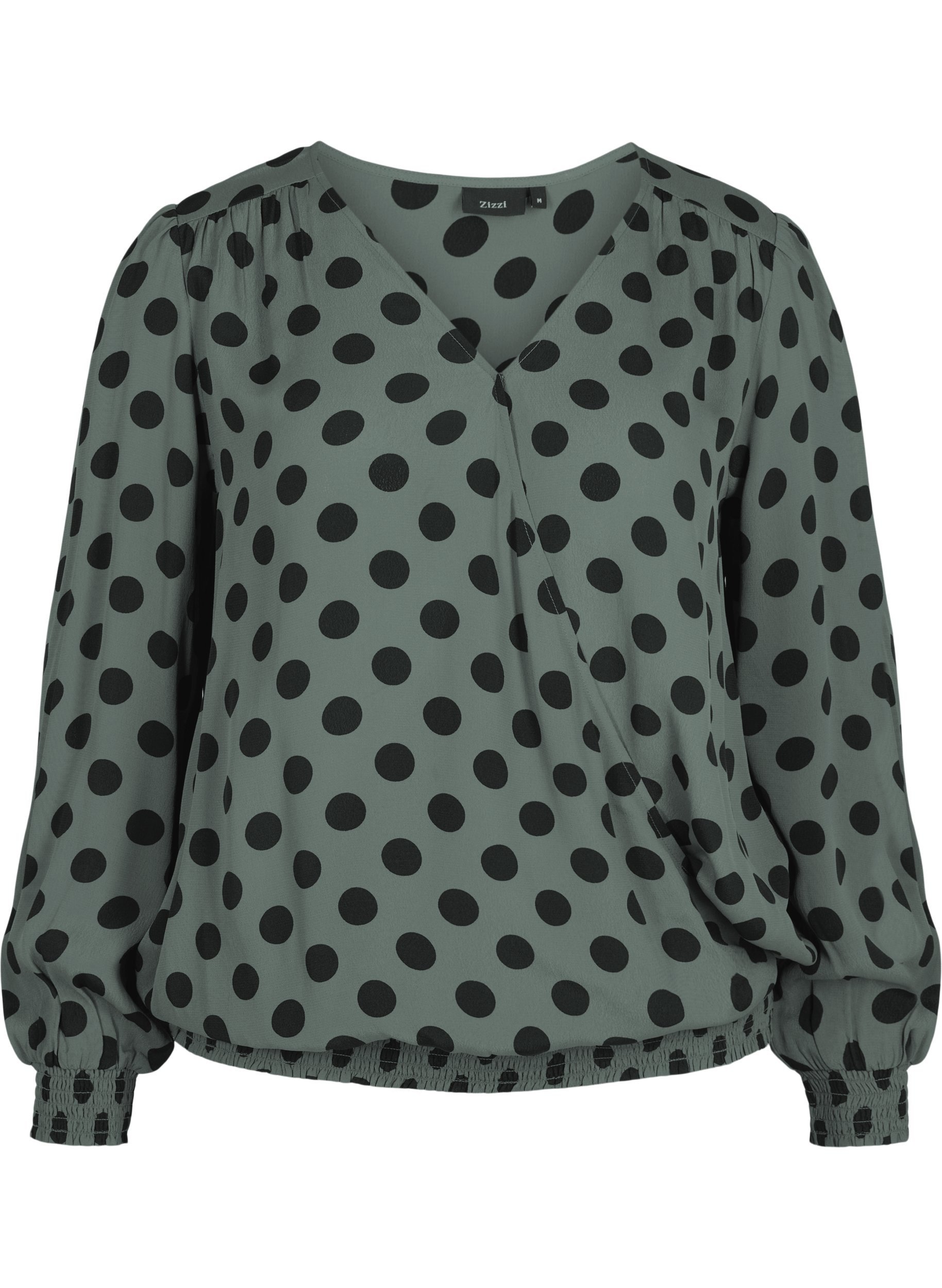 green and black polka dot blouse